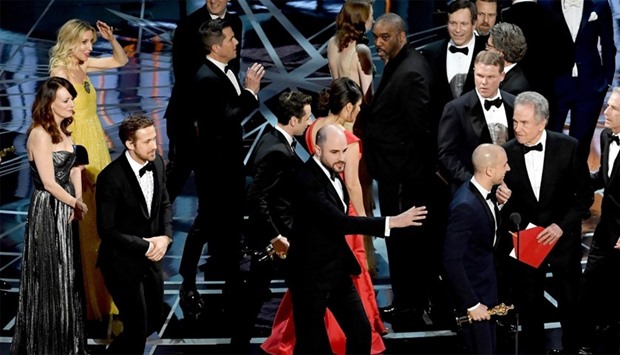 'La La Land' producer Jordan Horowitz (C) stops the show to announce the actual Best Picture winner as 'Moonlight' following a presentation error with actor Ryan Gosling (L), producer Fred Berger (2nd R) and actor Warren Beatty (R) onstage