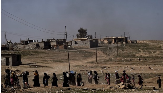 Displaced Iraqis flee the city of Mosul as Iraqi forces battle against Islamic State (IS) group jihadists to recapture the west of the city.