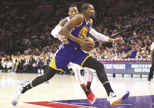 Warriors forward Kevin Durant (No 35) drives against 76ers Robert Covington during the first quarter of their NBA game at Wells Fargo Centre. PICTURE: USA TODAY Sports