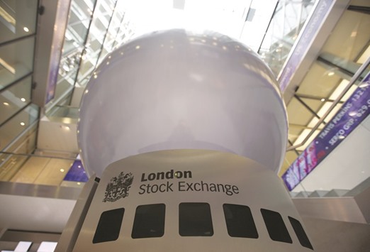 A logo is displayed on an interactive sculpture in the main atrium of the London Stock Exchange. The FTSE 100 closed up 0.1% to 7,263.44 points yesterday.