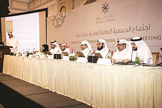 Sheikh Mohamed and other Barwa Bank directors during the companyu2019s AGM at the Four Seasons on Monday.