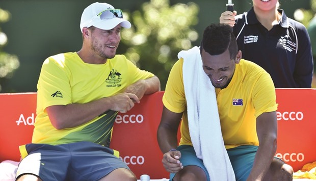 Australia team captain Lleyton Hewitt (left) chats with Nick Krygios ahead of his Davis Cup singles game against Jiri Vesely of Czech Republic in Melbourne yesterday. (AFP)