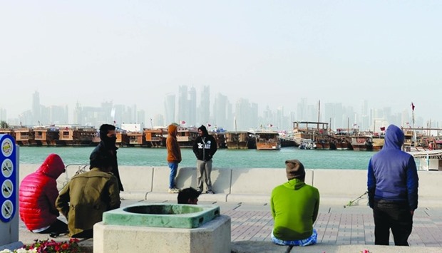 With mercury dropping to a minimum of 10C in Doha on Friday, people had to pile on warm clothing and curtail outdoor activities. A scene from Doha Corniche afternoon. PICTURE: Shaji Kayamkulam.