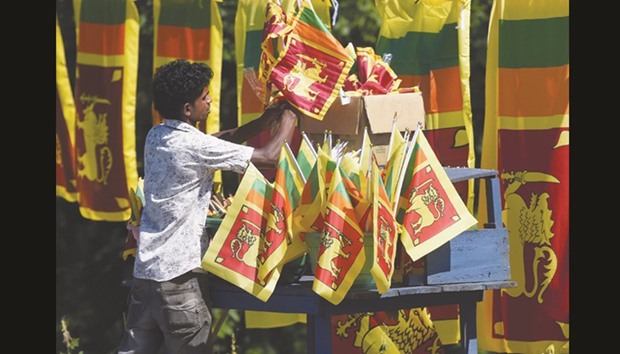A vendor sells national flags ahead of the islandu2019s Independence Day in Colombo yesterday. Sri Lanka is preparing to mark the 69th anniversary of independence from Britain today.