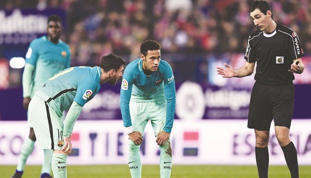 File picture of Barcelonau2019s Argentinian forward Lionel Messi (L) beside Barcelonau2019s Brazilian forward Neymar (C).