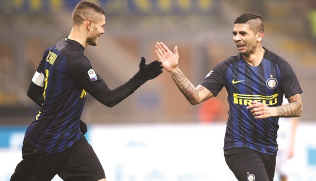 File picture of Inter Milanu2019s Ever Banega (R) celebrating with his teammate Mauro Icardi after scoring against Lazio.