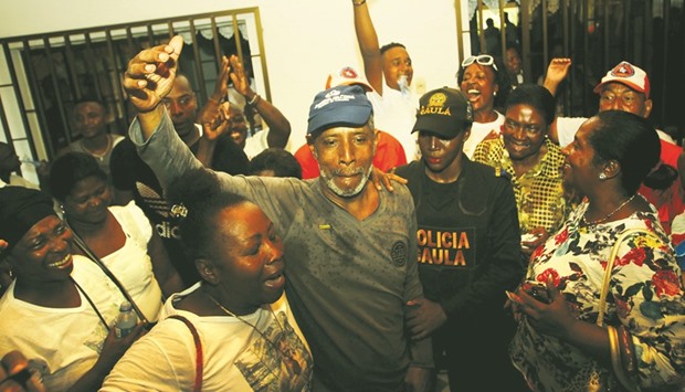 Former Colombian state governor, Odin Sanchez, who was held hostage by National Liberation Army (ELN) rebels for over 10 months, greets relatives and friends upon his release, after arriving at his house in Quibdo, Colombia.