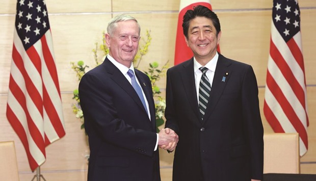 US Defence Secretary James Mattis (left) and Japanese PM Shinzo Abe shake hands at the prime ministeru2019s office in Tokyo yesterday.