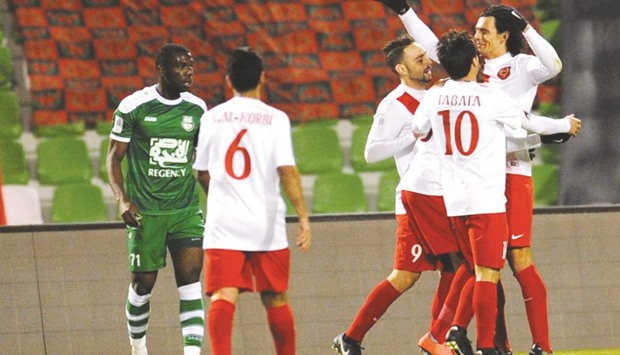 Al Rayyanu2019s Sebastian Soria celebrates a goal with teammate during their QSL match against Al Ahli yesterday. PICTURES: Shemeer Rasheed and Jayan Orma