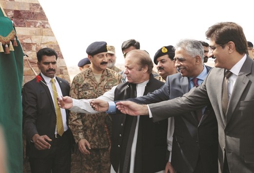 Pakistani PM Nawaz Sharif, centre, attends a ceremony to inaugurate the M9 motorway between Karachi and Hyderabad, near Hyderabad, yesterday.