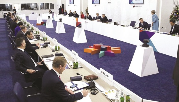 EU leaders sit at the conference table at the European Union leaders summit yesterday in Valletta.