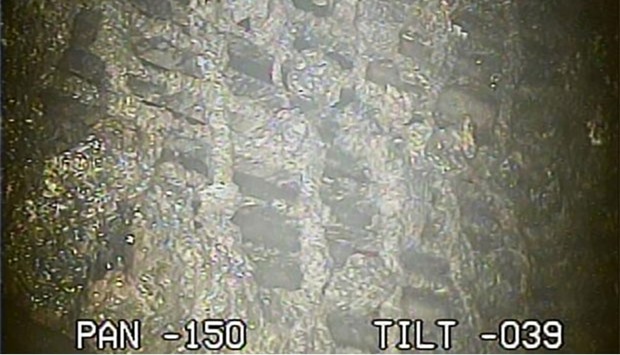 This handout video grab from Tokyo Electric Power Co. shows the inside of the No. 2 reactor, just below the pressure vessel, at TEPCO's Fukushima Dai-ichi nuclear power plant in Okuma town, Fukushima prefecture.