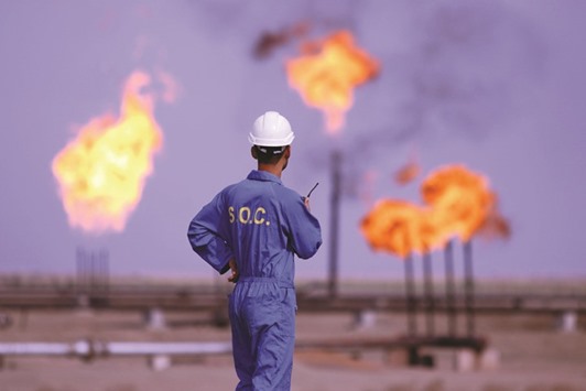 An Iraqi labourer works at an oil refinery in the southern town Nasiriyah (file). The nationu2019s exports decreased 187,000 bpd to 3.323mn bpd in January from the previous month, according to a person familiar with the matter.