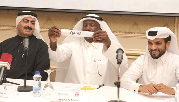 Qatar Rugby Federation (QRF) Events Committee manager Abdulla al-Khater (centre) picks Qatar to be part of Pool B in the presence of QRF president Yousef al-Kuwari (left) during the draw ceremony.