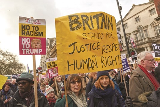 Demonstrators march in central London.
