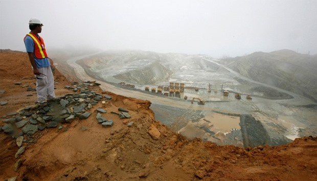 A worker looks at the Rapu Rapu open pit mine