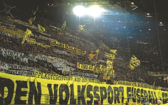 Borussia Dortmund fans display anti-RB Leipzig banners prior to the Bundesliga match, in Dortmund, western Germany, on Saturday. (AFP)