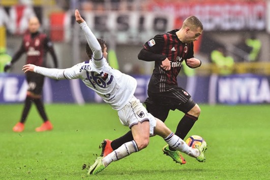 Sampdoriau2019s midfielder Karol Linetty (left) fights for the ball with AC Milanu2019s forward Gerard Deulofeu during the Serie A match in Milan  (AFP)