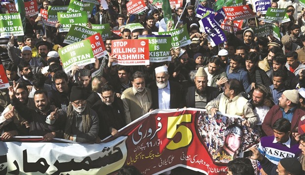 Activists of Jamaat-e-Islami Pakistan march in a protest to mark Kashmir Solidarity Day in Lahore yesterday.  Kashmir Solidarity Day is observed in Pakistan on February 5 as a way of showing support for those living in Indian-administered Kashmir.