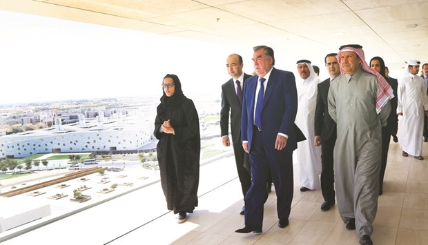Tajikistan President Emomali Rahmon, with QFu2019s Saad Ibrahim al-Muhannadi, viewing the education and research buildings of Education City from the open-air viewing platform at QF HQ yesterday.