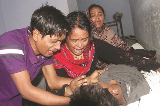 Relatives of Faisal Hossain react over his dead body in Chittagong yesterday.
