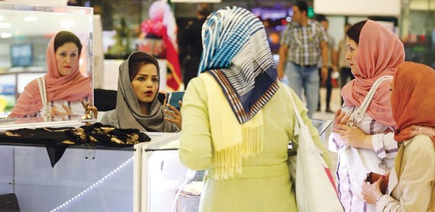 Iranian women shop at a mall in the southern resort island of Kish on November 1, 2016. Iranu2019s oil production has bounced back to pre-sanctions levels. In addition, although foreign investment hasnu2019t yet come close to the hoped-for $30bn to $50bn per year, itu2019s increased by 42% since the agreement took effect, the government said in January. The government is counting on those flows to support the budget for the coming fiscal year, which begins in March.