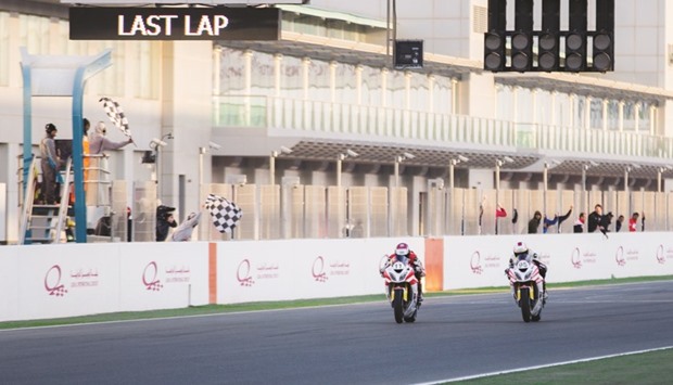Saeed al-Sulaiti and Mishal al-Naimi during their close finish in the second race of the QSTK at the Losail Circuit.