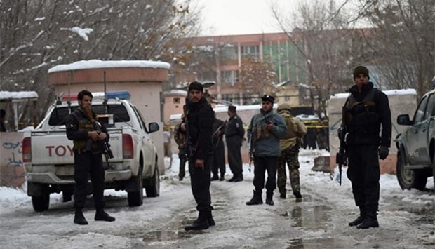 Afghan security personnel stand guard at the site of a suicide blast near the Afghan Supreme Court in Kabul on Tuesday.