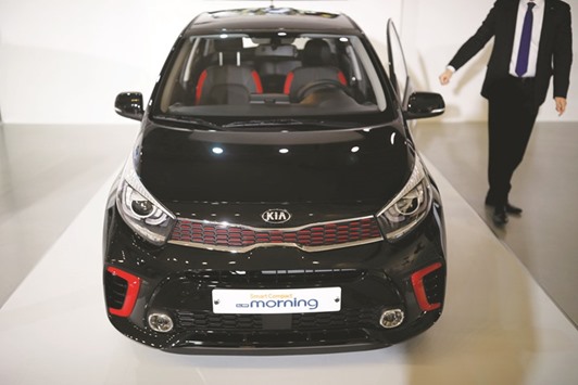 Kia Motoru2019s Morning compact car is seen during its unveiling ceremony in Seoul. The company is hoping to leverage its affiliate, Hyundai Motoru2019s, supply chain network built over nearly two decades to gain a foothold in Indian market that is tipped to become the worldu2019s third largest by 2020.