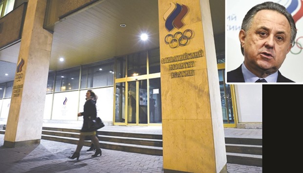 This file photo taken on November 9, 2015 shows women leaving the Russian Olympic Committee building which houses the headquarters of the All-Russian Athletics Federation in Moscow. TOP RIGHT INSERT: Vitaly Mutko