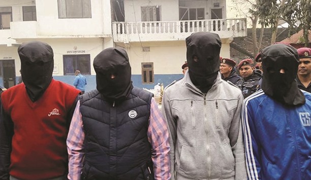 Police parade suspects who had been involved in various terror activities in Nepal and India, in Birgunj, 134km from Kathmandu, yesterday.