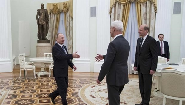 Russian President Vladimir Putin greets Volkswagen AG chief executive Matthias Mueller during their meeting at the Kremlin in Moscow on Wednesday.