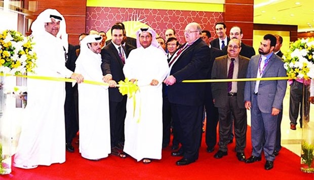Al Meera officials are pictured at the ribbon-cutting ceremony at the Umm Slal branch.