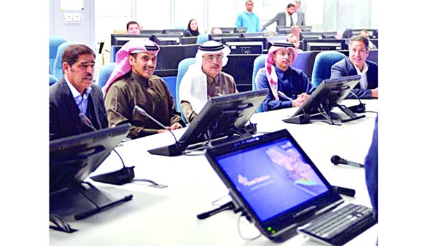 Al-Kaabi (2nd left) attending a presentation with Nasser at Aramco yesterday.