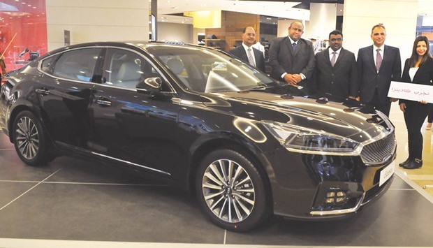 Hossam Abu Shadi (second right) of Al-Attiya Motors and Trading Company, the exclusive distributor of Kia in Qatar, at the unveiling of the all-new Kia Cadenza yesterday at The Gate Mall. PICTURE: Jayan Orma