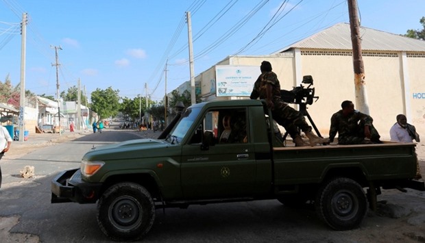 Somali government soldiers guard the area