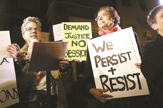 Dr E Faye Williams (right), president of the National Congress of Black Women, stands with other protesters demonstrating outside the house of Senate Majority Leader Mitch McConnell ahead of the Senate vote to confirm Sessions as attorney general.