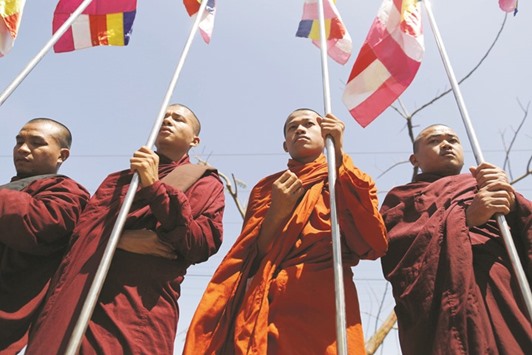 Buddhist monks protest while Malaysian NGOu2019s aid ship carrying food and emergency supplies for Rohingyas arrives at the port in Yangon.
