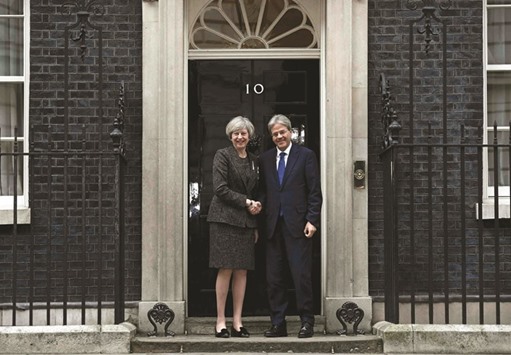 Britainu2019s Prime Minister Theresa May greets her Italian counterpart Paolo Gentiloni at Number 10 Downing Street in London, Britain, yesterday.