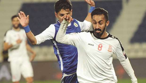 Umm Salalu2019s Adel al-Sulimane gets past a Al Khor defender during the QNB Stars League.