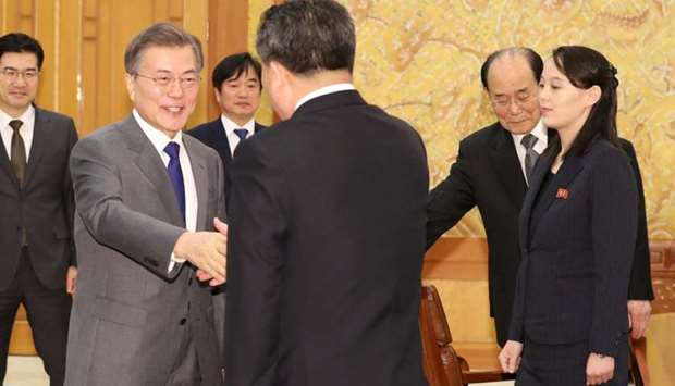 South Korean President Moon Jae-in shakes hands with president of the Presidium of the Supreme People's Assembly of North Korea Kim Young Nam as Kim Yo Jong, the sister of North Korea's leader Kim Jong Un, looks on at the Presidential Blue House in Seoul, South Korea
