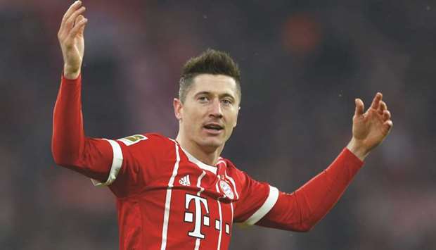 Bayern Munichu2019s Robert Lewandowski celebrates scoring a goal against Schalke in their Bundesliga match yesterday. (Reuters)