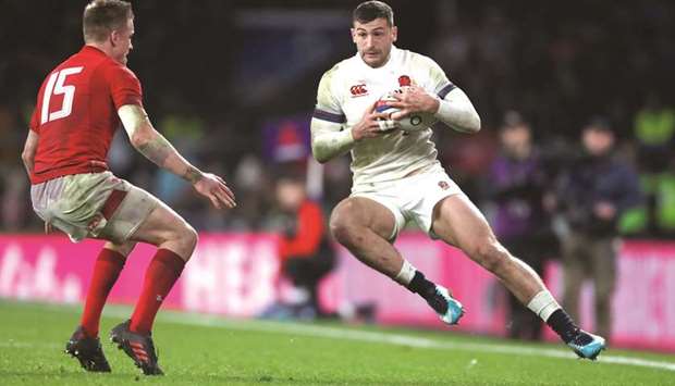 Englandu2019s Jonny May (right) attempts to get past Walesu2019 Gareth Anscombe during the Six Nations Championship at Twickenham Stadium in London. (Reuters)