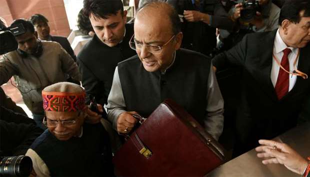 Indian Finance Minister Arun Jaitley (C) arrives at Parliament House to present the Union Budget in New Delhi