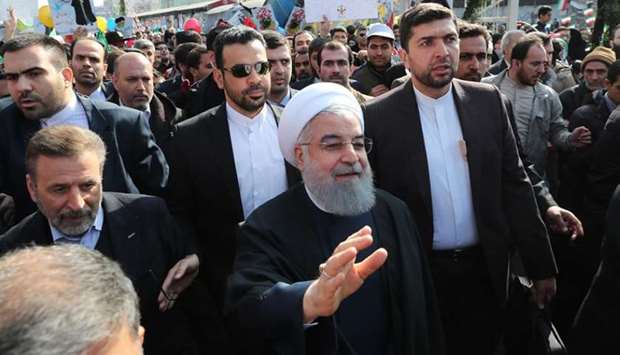 Iranian President Hassan Rouhani on February 11, 2018 shows him at the Azadi Square in the capital Tehran during a ceremony to mark the 39th anniversary of the Islamic revolution.