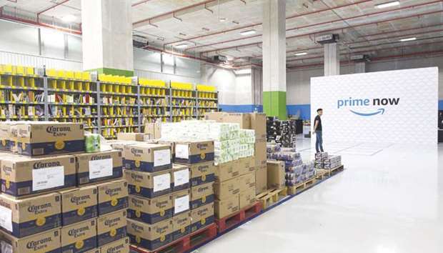 Merchandise sits on shelves and pallets at Amazon.comu2019s Prime Now fulfilment centre in Singapore. Now, the grocery world will get a first-hand look at Amazonu2019s strategy, with two-hour delivery available through its Prime Now service in Dallas and Austin, Texas; Virginia Beach, Virginia; and Cincinnati, Ohio.