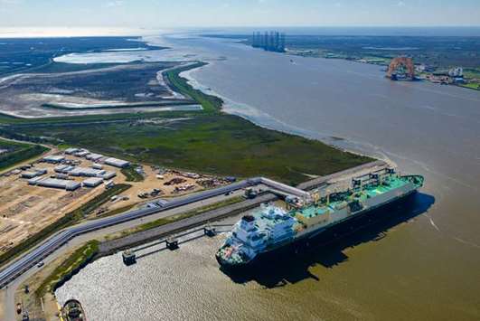 An LNG carrier sits docked at the Cheniere terminal in this aerial photograph taken over Sabine Pass, Texas on February 24, 2016. The agreement commits Cheniere to supply 1.2mn metric tonnes a year to China National Petroleum Corp through 2043, according to a statement released by the Houston-based exporter on Friday.