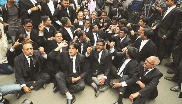 Lawyers supporting Bangladesh Nationalist Party (BNP) shout slogans as they sit on a street during a protest in Dhaka.