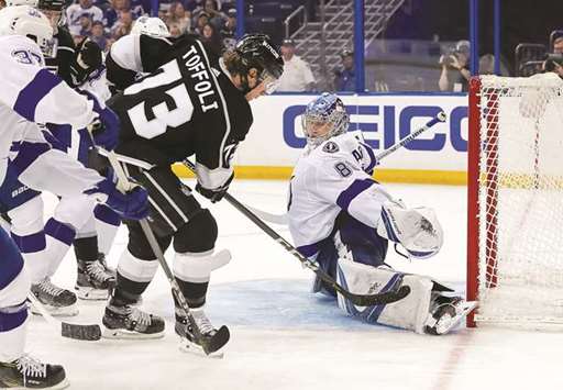 Andrei Vasilevskiy (right) of the Tampa Bay Lightning makes a save against Tyler Toffoli (second from right) of the Los Angeles Kings during the NHL game at the Amalie Arena in Tampa, Florida, on Saturday. (AFP)