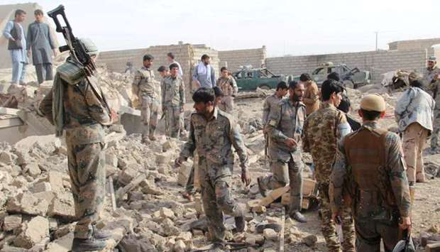 Afghan officials inspect the site of a truck bomb attack in Helmand on November 10, 2017. File picture.